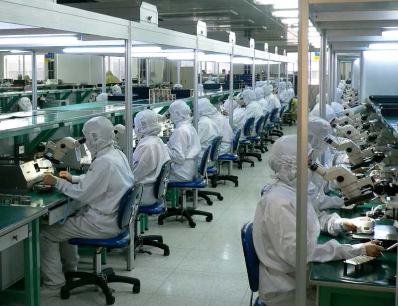 factory workers assembling electronic products