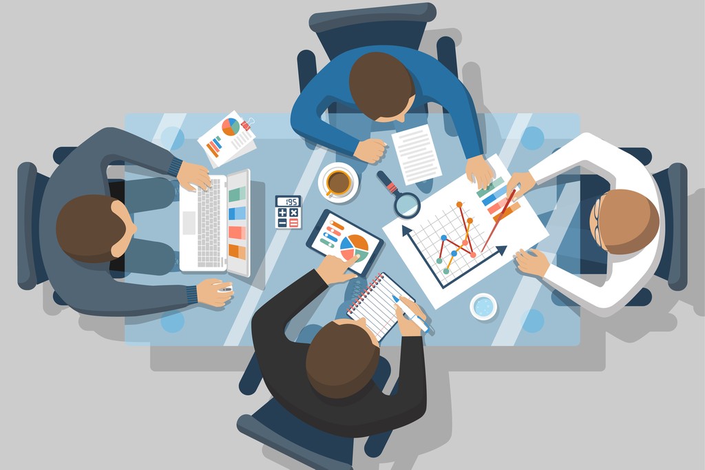 team of advisors around meeting table
