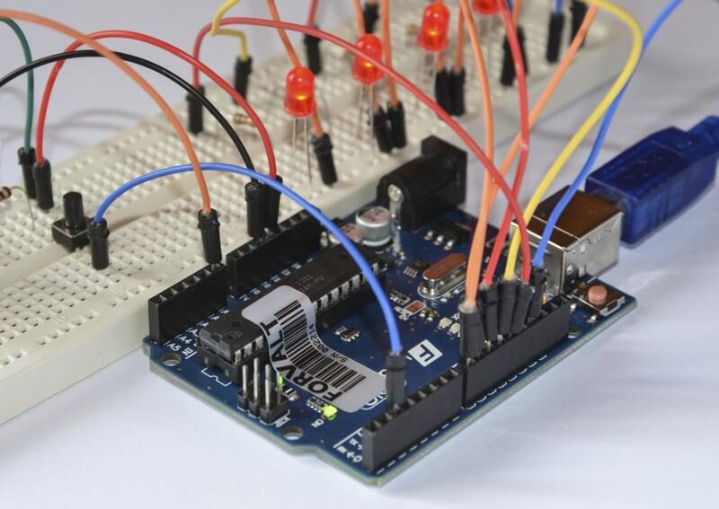 Arduino board connected to a breadboard circuit